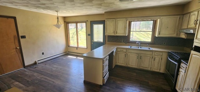 kitchen featuring a sink, light countertops, range with gas stovetop, and under cabinet range hood