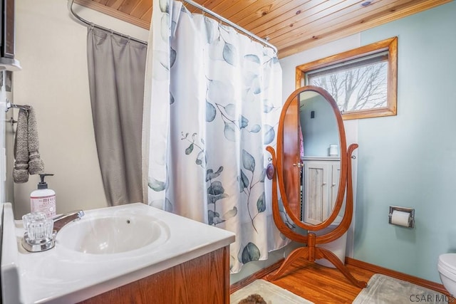 bathroom with a shower with shower curtain, toilet, wooden ceiling, and vanity