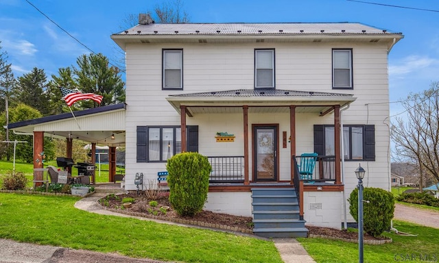 view of front of house featuring a front yard and a porch