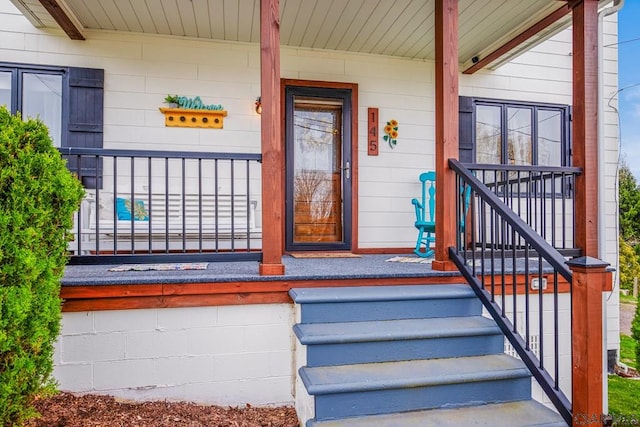 doorway to property featuring a porch