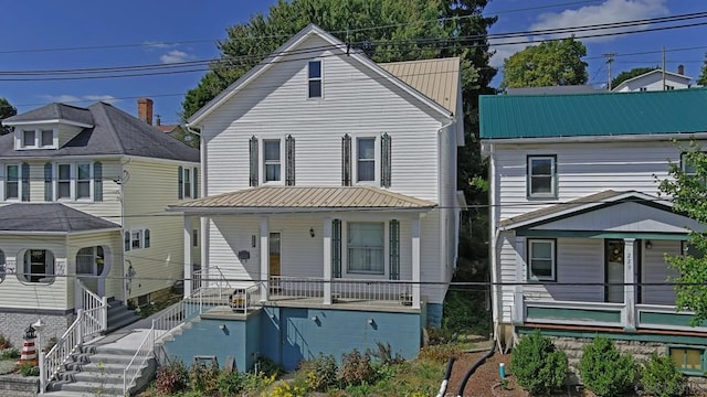 view of property featuring covered porch