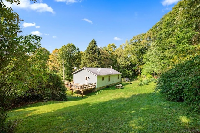 view of yard with a wooden deck