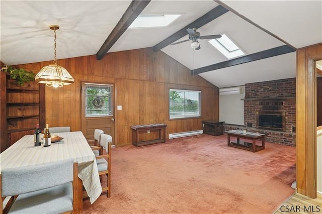 112 Ottawa Ln, Central City, PA 15926 - carpeted bedroom with a skylight, multiple windows, a baseboard heating unit, wooden walls, and a brick fireplace