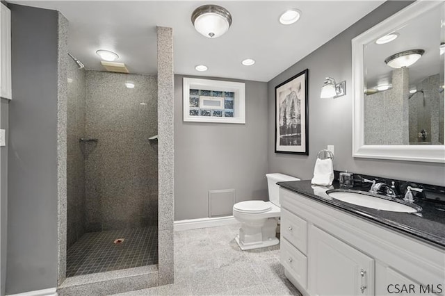 112 Ottawa Ln, Central City, PA 15926 - bathroom with toilet, tiled shower, vanity, recessed lighting, and baseboards