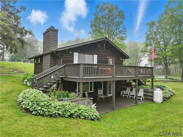 112 Ottawa Ln, Central City, PA 15926 - rear view of property with stairway, a wooden deck, a patio, a chimney, and a lawn