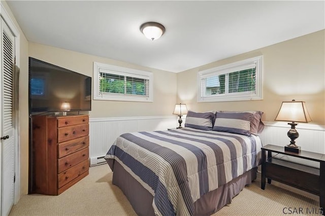 112 Ottawa Ln, Central City, PA 15926 - carpeted bedroom with wainscoting, multiple windows, and a closet