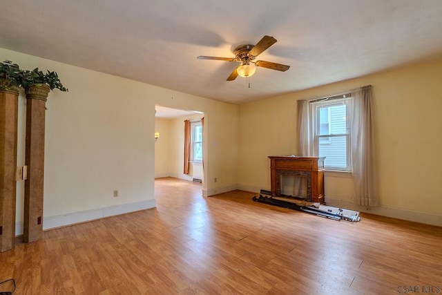 1461 Franklin St, Johnstown, PA 15905 - unfurnished living room with light wood-type flooring, ceiling fan, and plenty of natural light