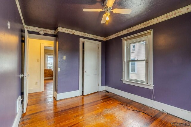 1461 Franklin St, Johnstown, PA 15905 - unfurnished bedroom with hardwood / wood-style flooring, baseboards, ceiling fan, and a closet