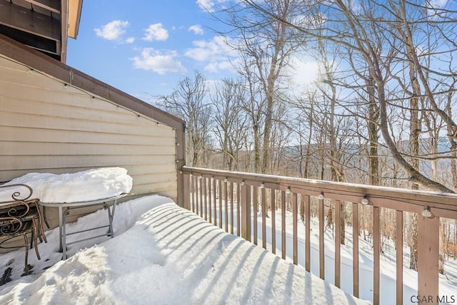 view of snow covered deck