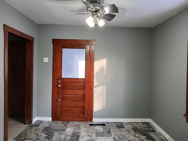 foyer entrance with ceiling fan