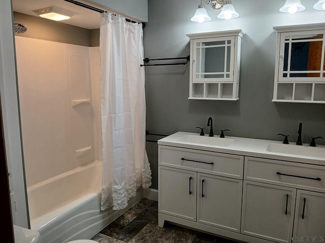 bathroom featuring vanity and shower / bathtub combination with curtain