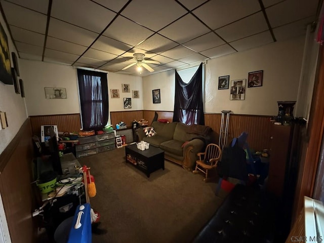 190 Beatty Ave, Johnstown, PA 15906 - carpeted living room featuring a wainscoted wall, a drop ceiling, a ceiling fan, and wood walls