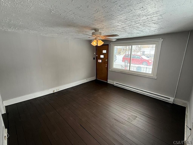 unfurnished room featuring dark wood-style floors, a baseboard radiator, baseboards, and a textured ceiling