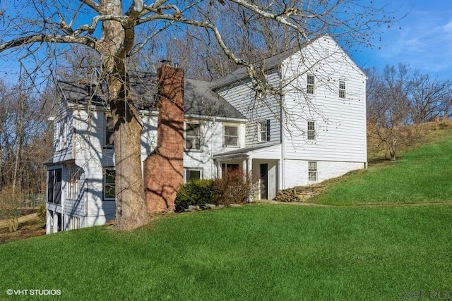 view of home's exterior featuring a lawn