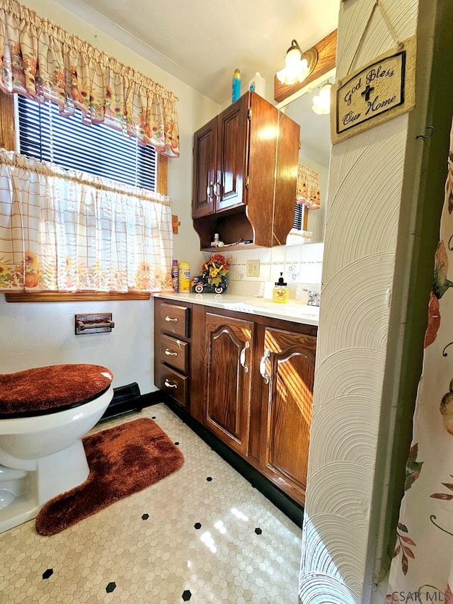 kitchen featuring tasteful backsplash, light countertops, and light floors