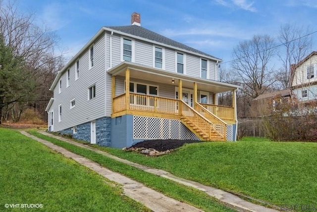 view of front of property featuring covered porch and a front yard