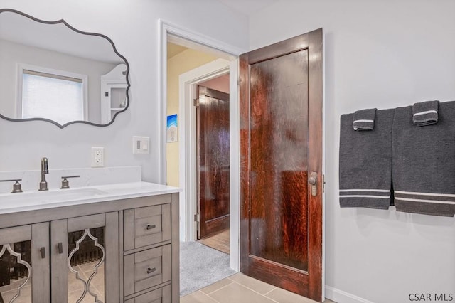 bathroom featuring tile patterned floors and vanity