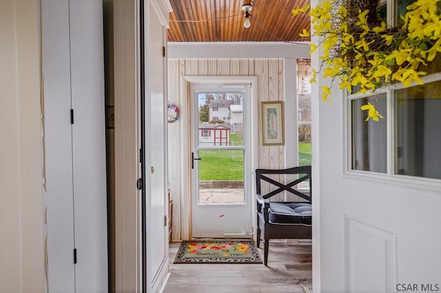 doorway featuring wooden ceiling and wood finished floors