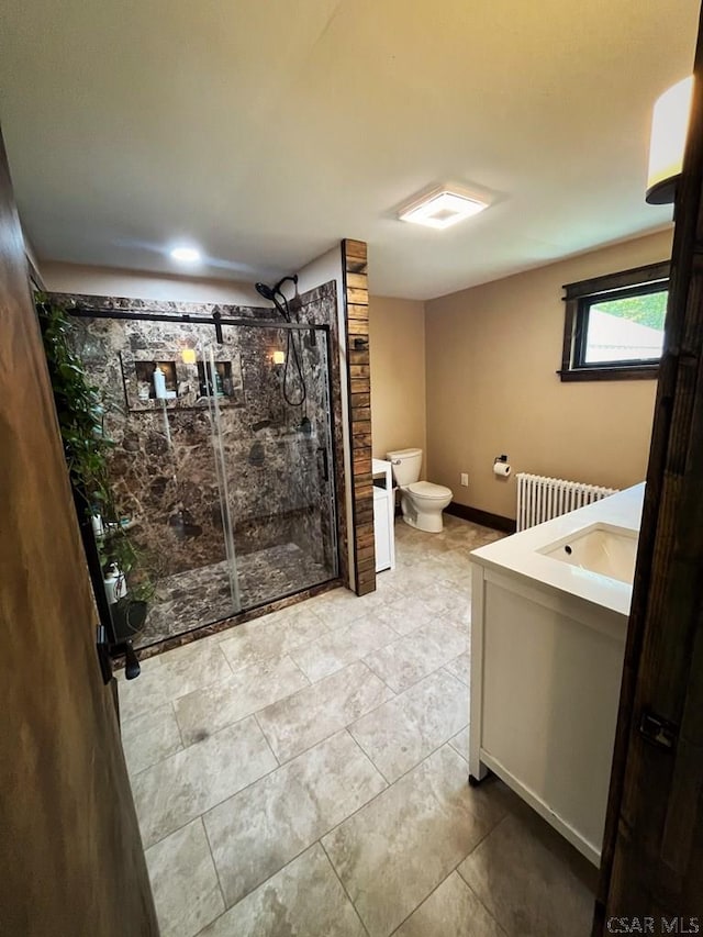909 Snake Rd, Ebensburg, PA 15931 - bathroom with radiator, toilet, a stall shower, vanity, and baseboards