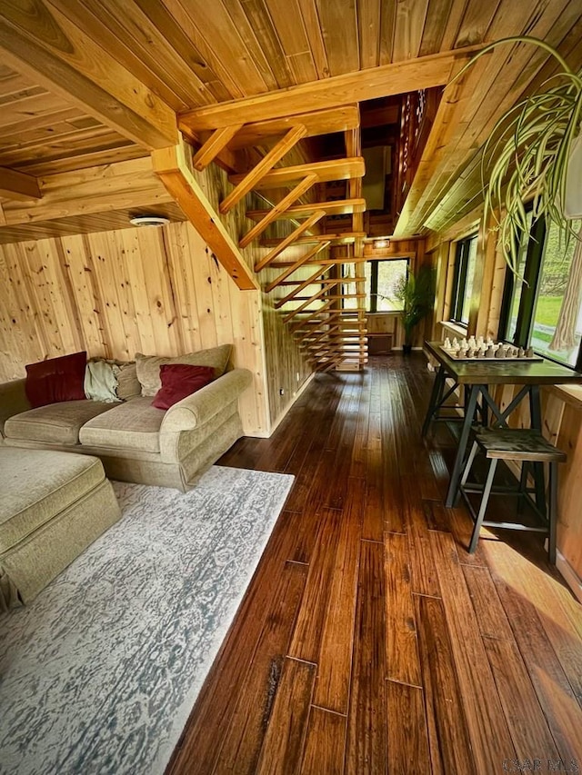 909 Snake Rd, Ebensburg, PA 15931 - unfurnished living room with wooden walls, wooden ceiling, hardwood / wood-style flooring, plenty of natural light, and stairway