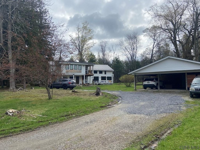 909 Snake Rd, Ebensburg, PA 15931 - view of front facade featuring driveway, a carport, and a front lawn