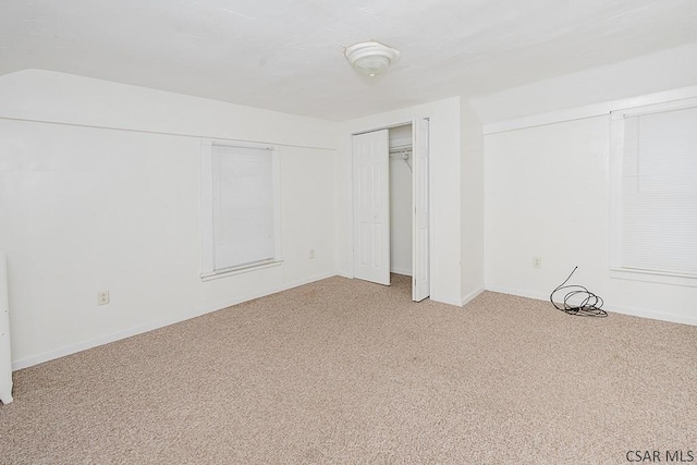 interior space with carpet flooring and a closet