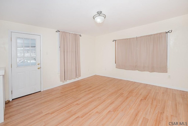 spare room featuring light hardwood / wood-style floors