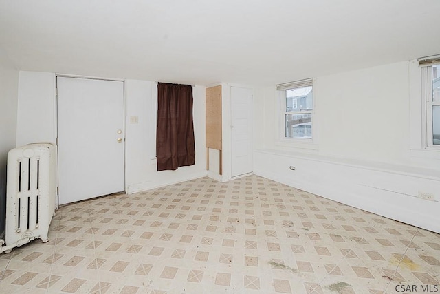 empty room featuring radiator heating unit