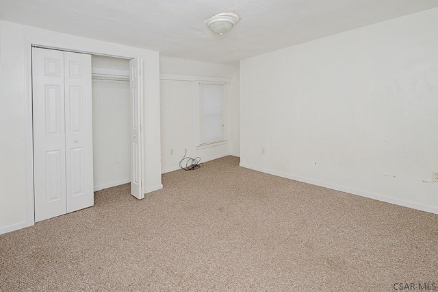 unfurnished bedroom with carpet flooring