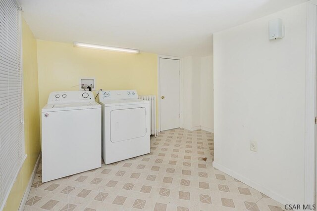 clothes washing area featuring washer and clothes dryer