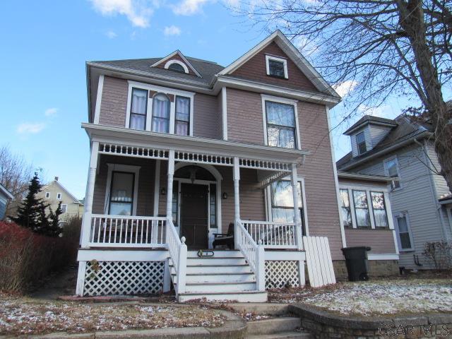 victorian-style house with a porch