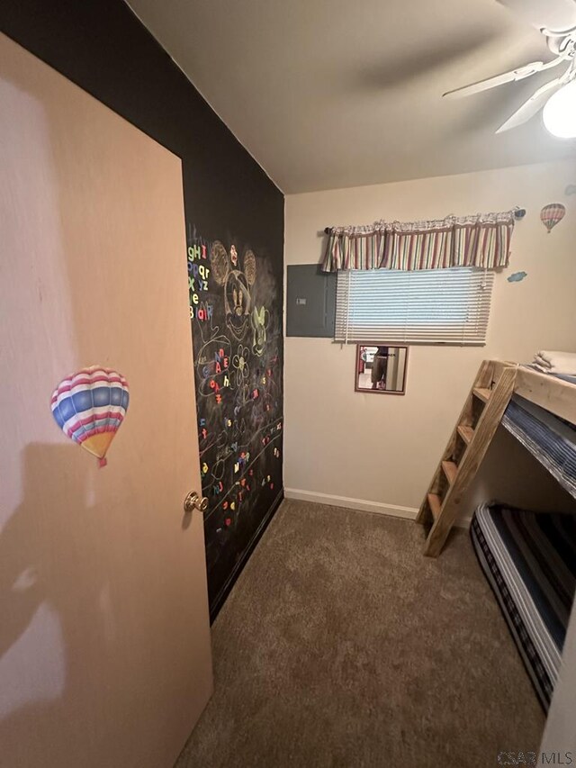 carpeted bedroom featuring ceiling fan and electric panel