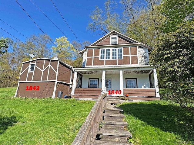 1840 Soap Hollow Rd, Tire Hill, PA 15959 - traditional style home featuring a porch, a front lawn, stucco siding, and crawl space