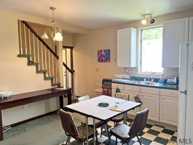 1310 Krayn Rd, Windber, PA 15963 - dining area with a chandelier and stairway