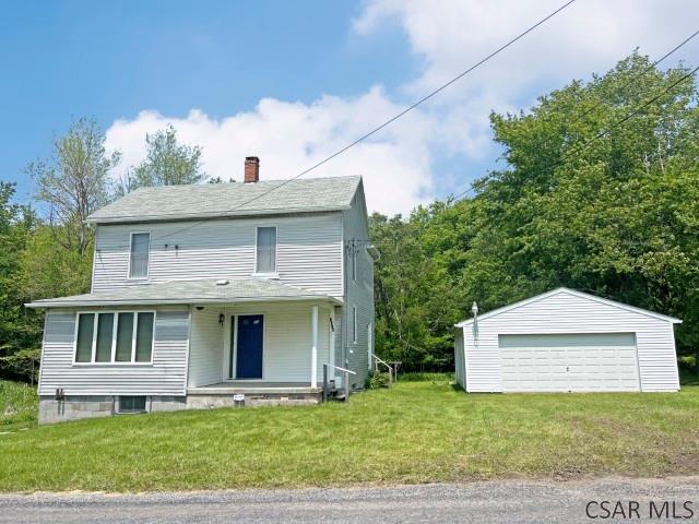 1310 Krayn Rd, Windber, PA 15963 - view of front of house with a chimney, a detached garage, an outdoor structure, and a front yard
