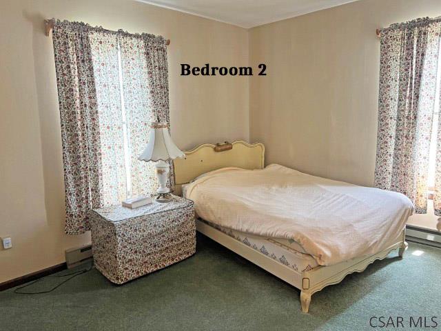 1310 Krayn Rd, Windber, PA 15963 - carpeted bedroom with a baseboard heating unit