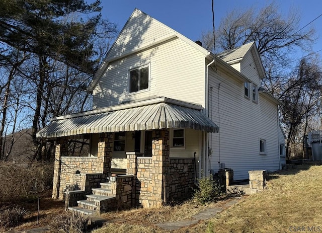 view of home's exterior with a porch