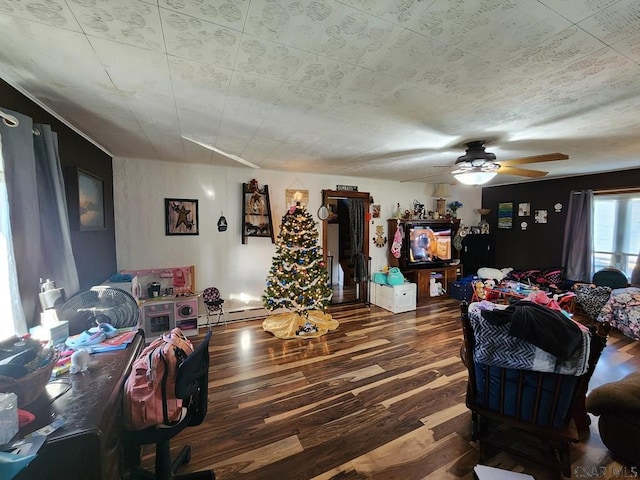 living room featuring dark hardwood / wood-style floors and ceiling fan