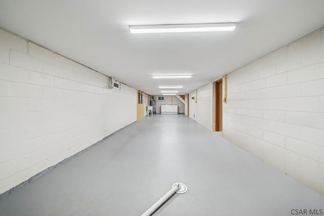 interior space featuring concrete block wall