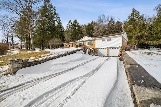 view of front of home with driveway and an attached garage