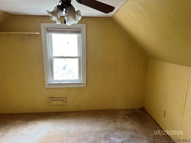 bonus room with vaulted ceiling, carpet floors, and ceiling fan