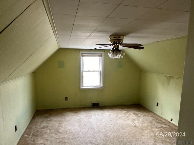 additional living space featuring ceiling fan, light colored carpet, and vaulted ceiling