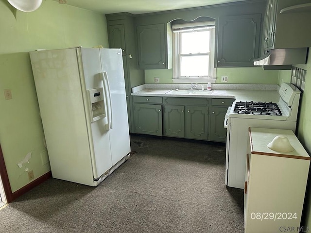 kitchen featuring sink and white appliances