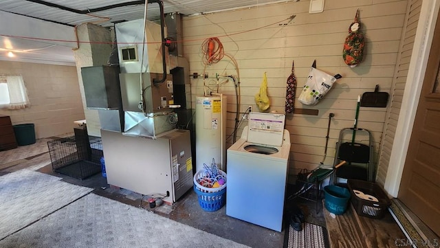 utility room with washer / clothes dryer and water heater