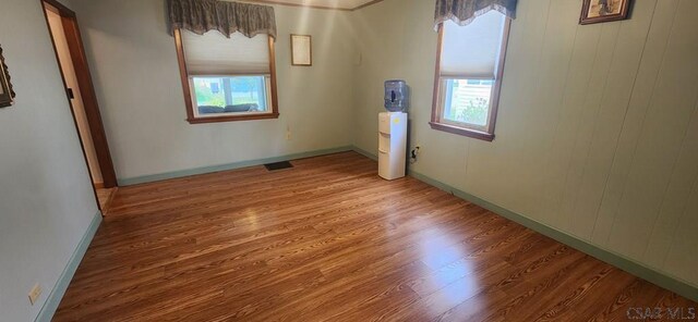 spare room with hardwood / wood-style floors