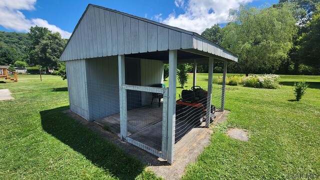 view of outbuilding with a lawn