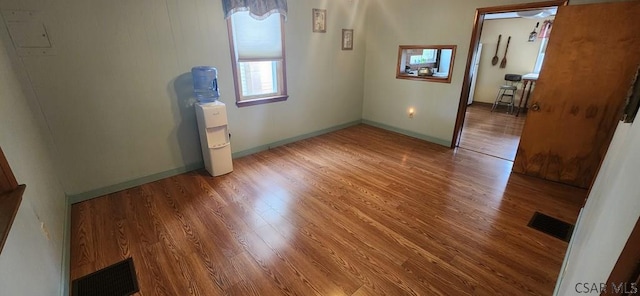 spare room featuring hardwood / wood-style flooring