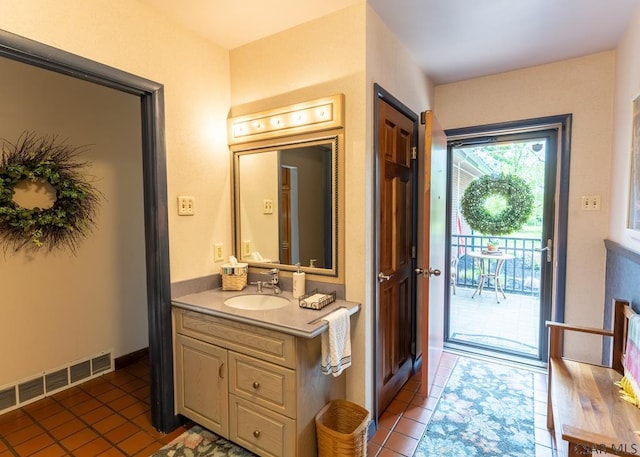 bathroom with vanity and tile patterned floors