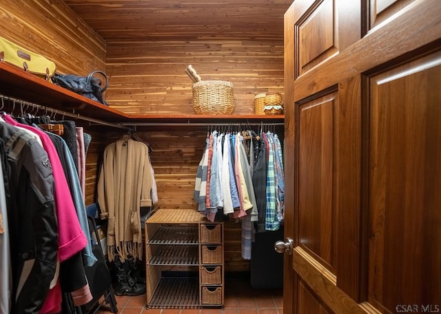 spacious closet with light tile patterned floors