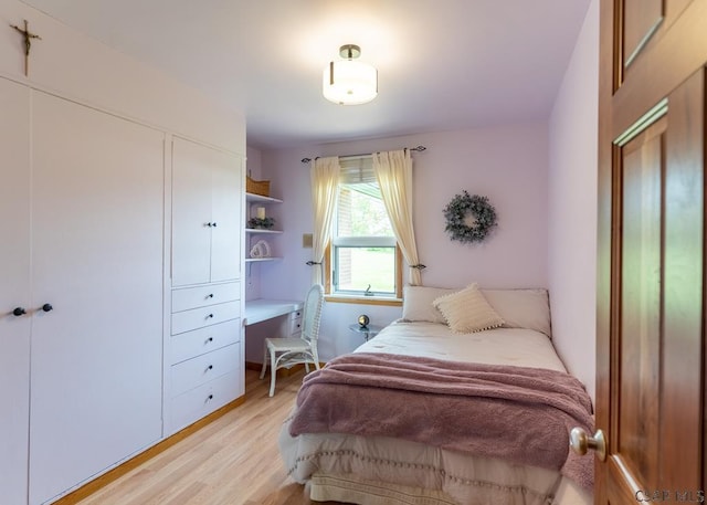 bedroom featuring light wood-type flooring